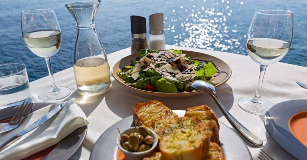 Food and Wine table with food and wine overlooking the water