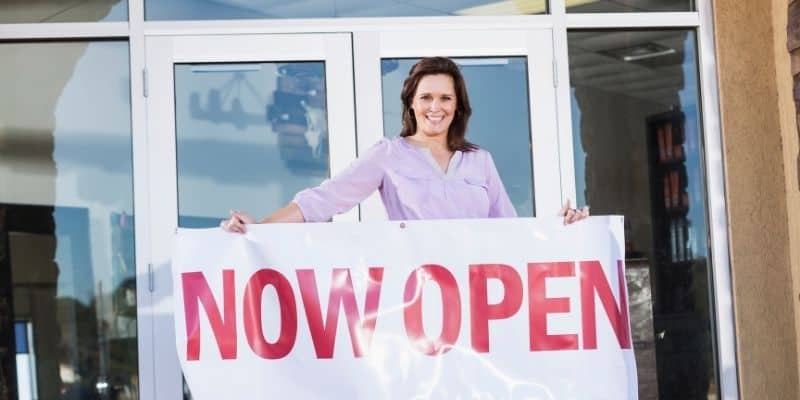 gift ideas for new business owner woman with grand opening sign