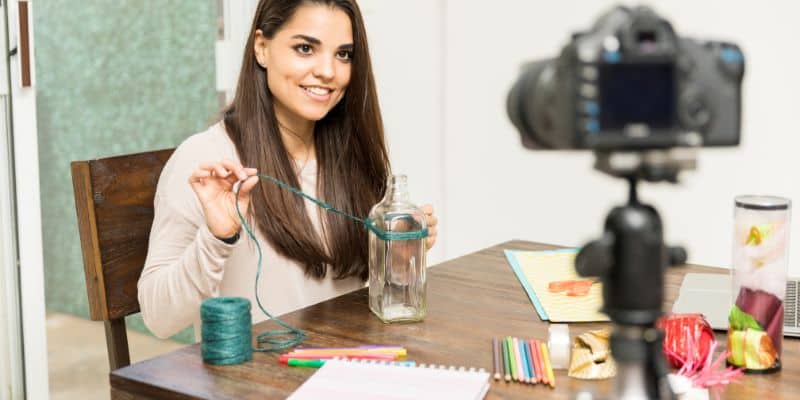 craft and DIY blogger filming herself making a craft project