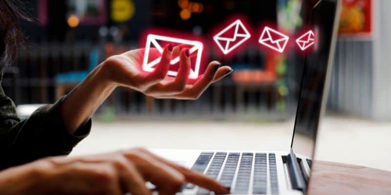 woman with red envelopes floating into laptop