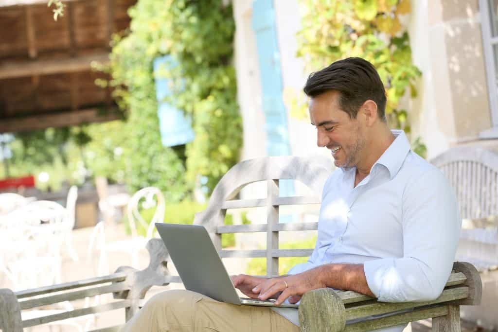 Mature man on week-end working from home with laptop