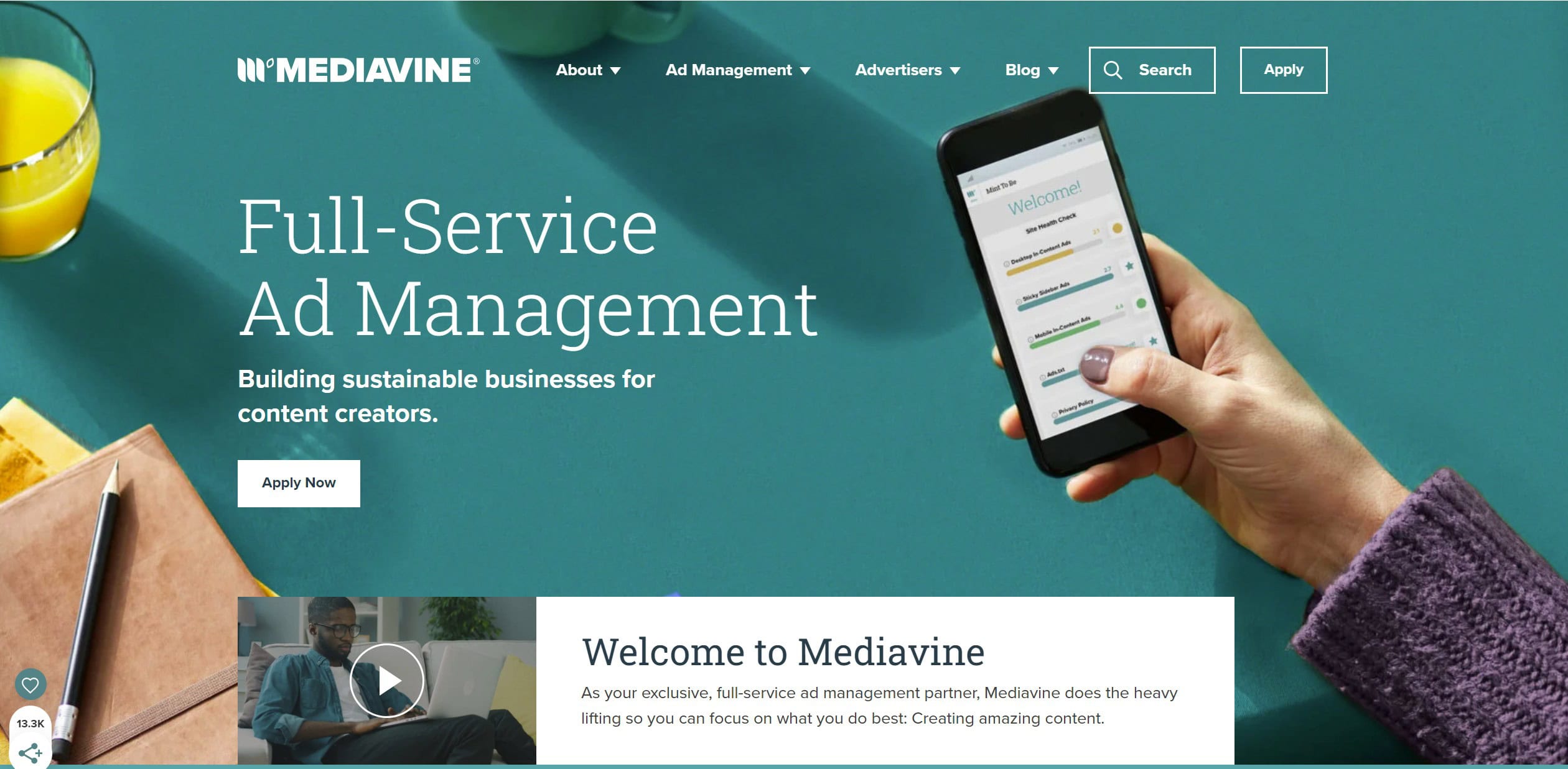 A website banner for Mediavine showcasing "Full-Service Ad Management" with a subheading "Building sustainable businesses for content creators." A person is holding a smartphone displaying the Mediavine app, highlighting how it prevents amateur blogging mistakes. Below, a section titled "Welcome to Mediavine" is shown.