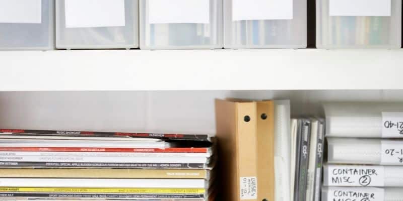 organized bookshelves with folders and magazines