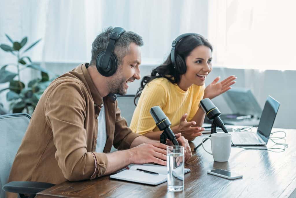 two podcasters laughing