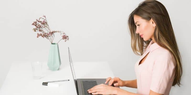 woman typing on computer